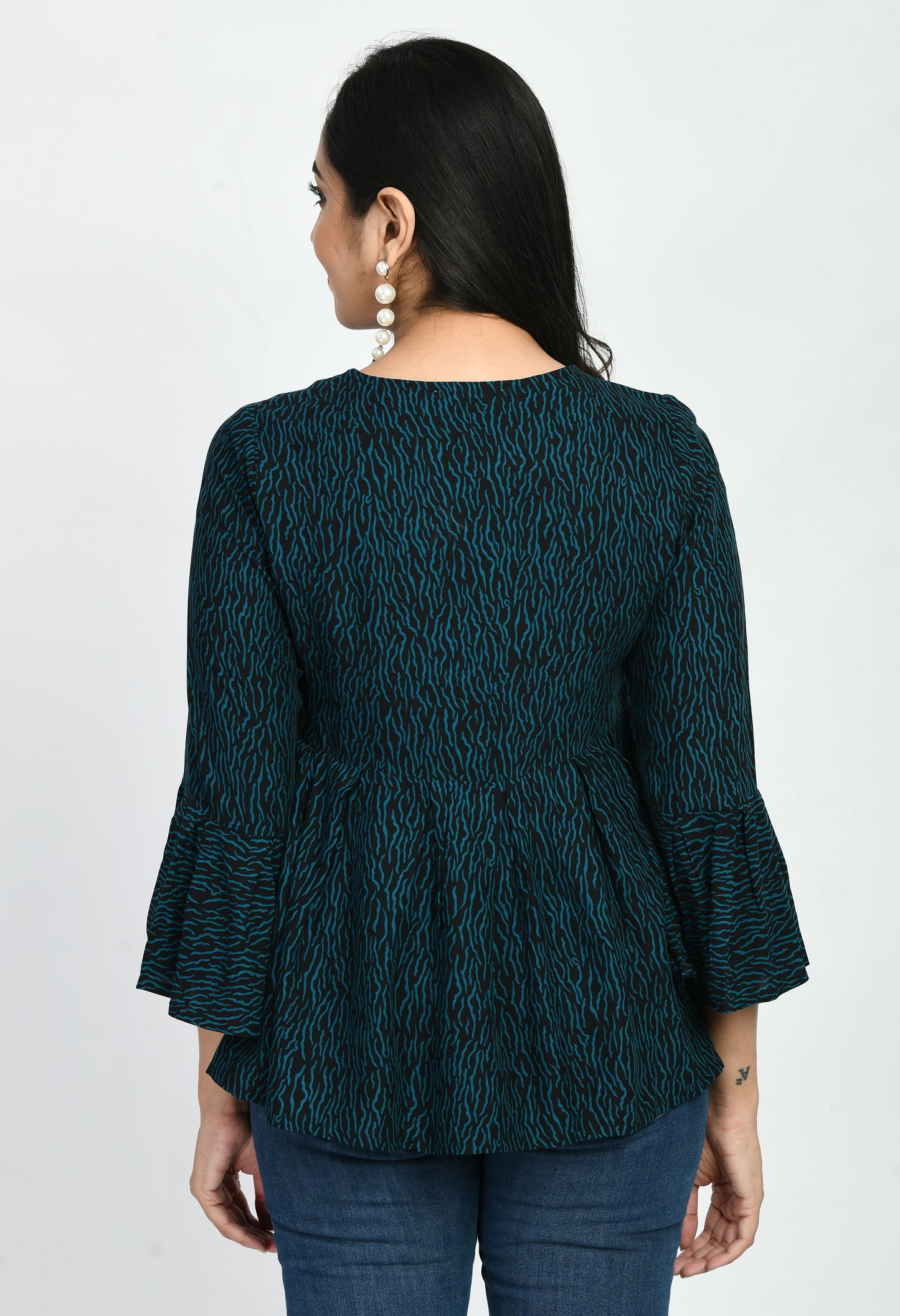 "Elegant Printed Top featuring a classic print design, crafted from soft, breathable fabric. Perfect for everyday wear with a regular fit that pairs easily with jeans, skirts, or trousers."