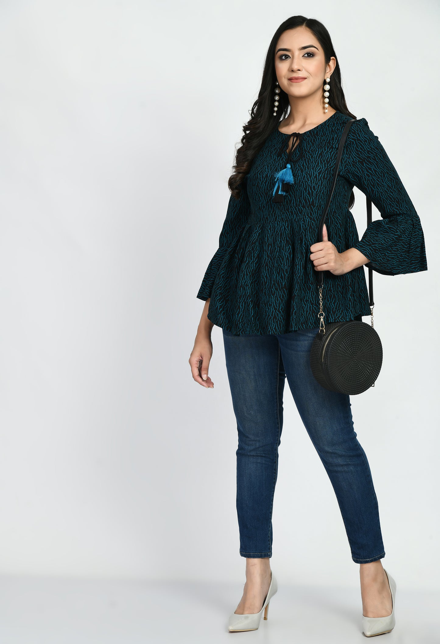 "Elegant Printed Top featuring a classic print design, crafted from soft, breathable fabric. Perfect for everyday wear with a regular fit that pairs easily with jeans, skirts, or trousers."