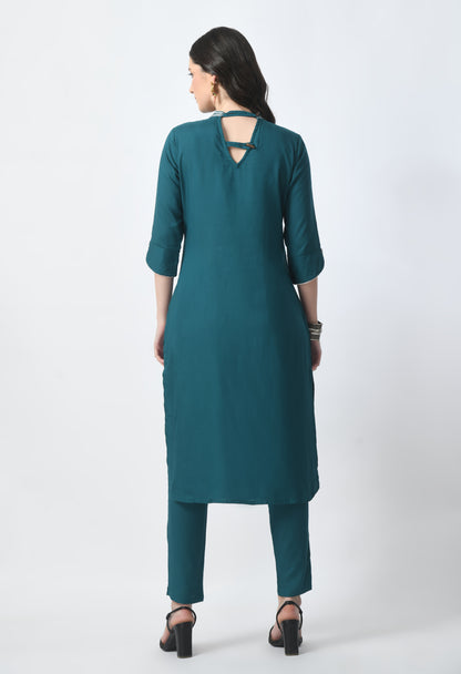 “Bottle green embroidered rayon kurta pant set with a printed dupatta. The kurta features intricate embroidery, paired with matching pants and a vibrant dupatta with distinctive patterns, combining traditional elegance with modern style.”