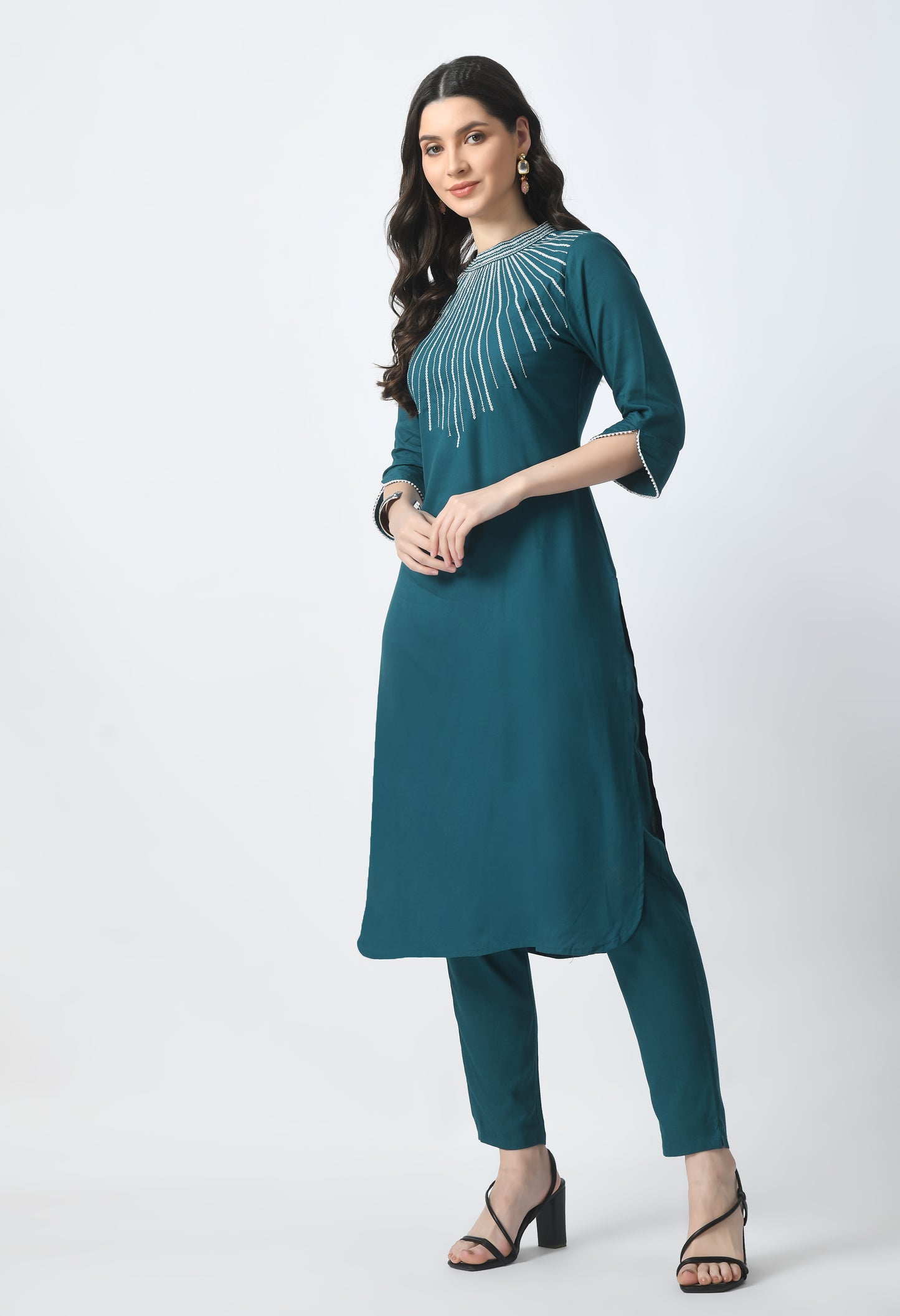 “Bottle green embroidered rayon kurta pant set with a printed dupatta. The kurta features intricate embroidery, paired with matching pants and a vibrant dupatta with distinctive patterns, combining traditional elegance with modern style.”