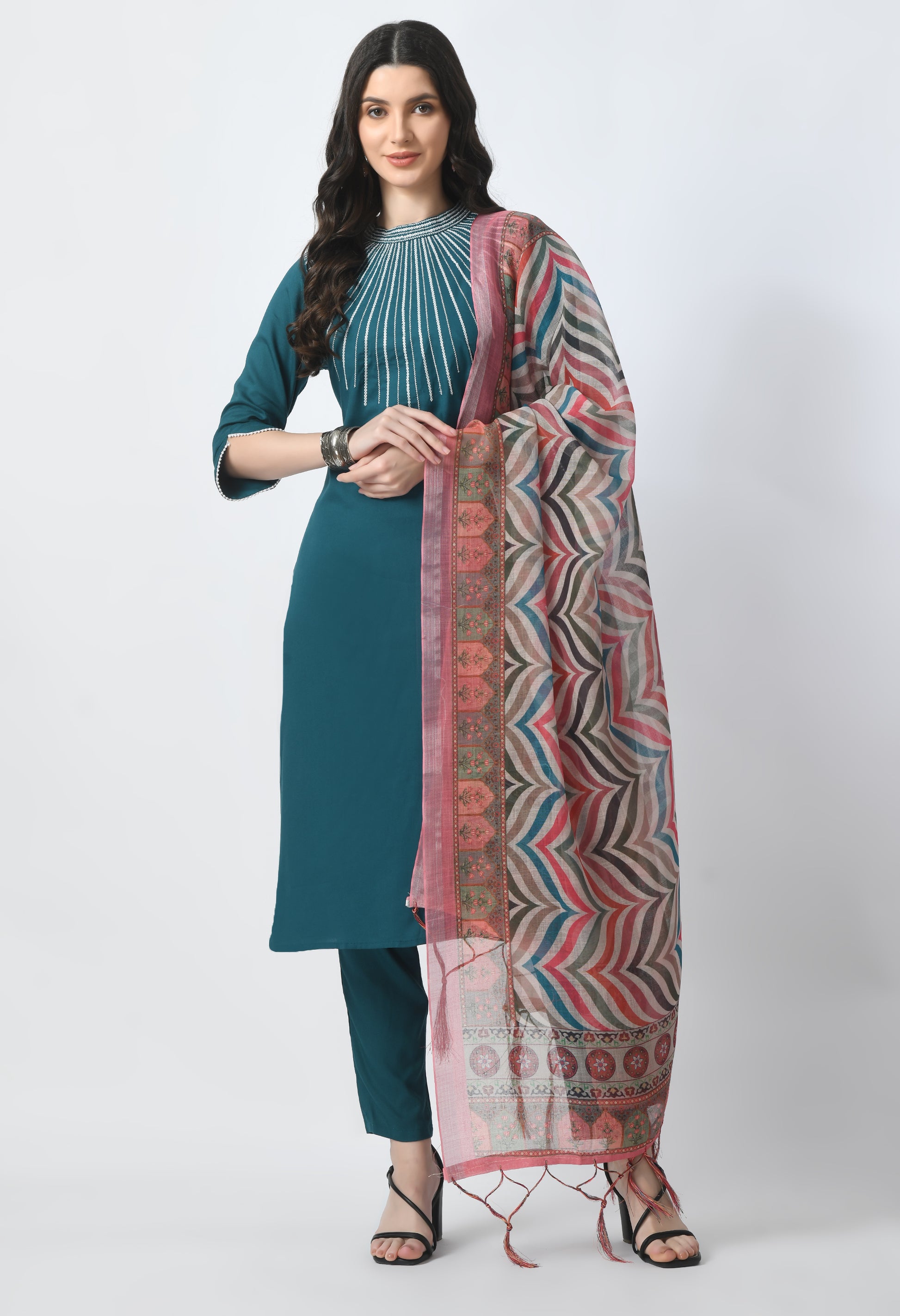 “Bottle green embroidered rayon kurta pant set with a printed dupatta. The kurta features intricate embroidery, paired with matching pants and a vibrant dupatta with distinctive patterns, combining traditional elegance with modern style.”