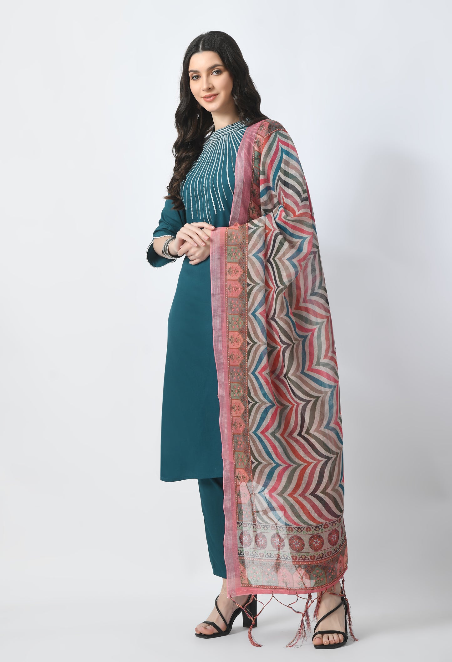 “Bottle green embroidered rayon kurta pant set with a printed dupatta. The kurta features intricate embroidery, paired with matching pants and a vibrant dupatta with distinctive patterns, combining traditional elegance with modern style.”