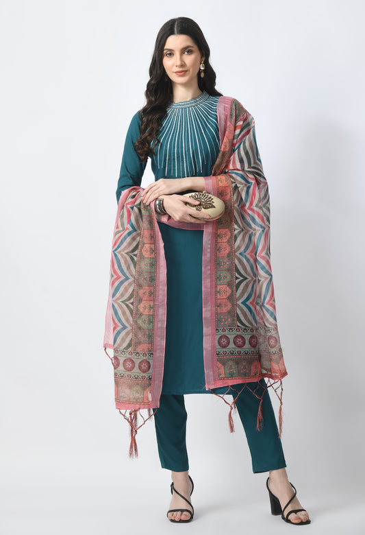 “Bottle green embroidered rayon kurta pant set with a printed dupatta. The kurta features intricate embroidery, paired with matching pants and a vibrant dupatta with distinctive patterns, combining traditional elegance with modern style.”