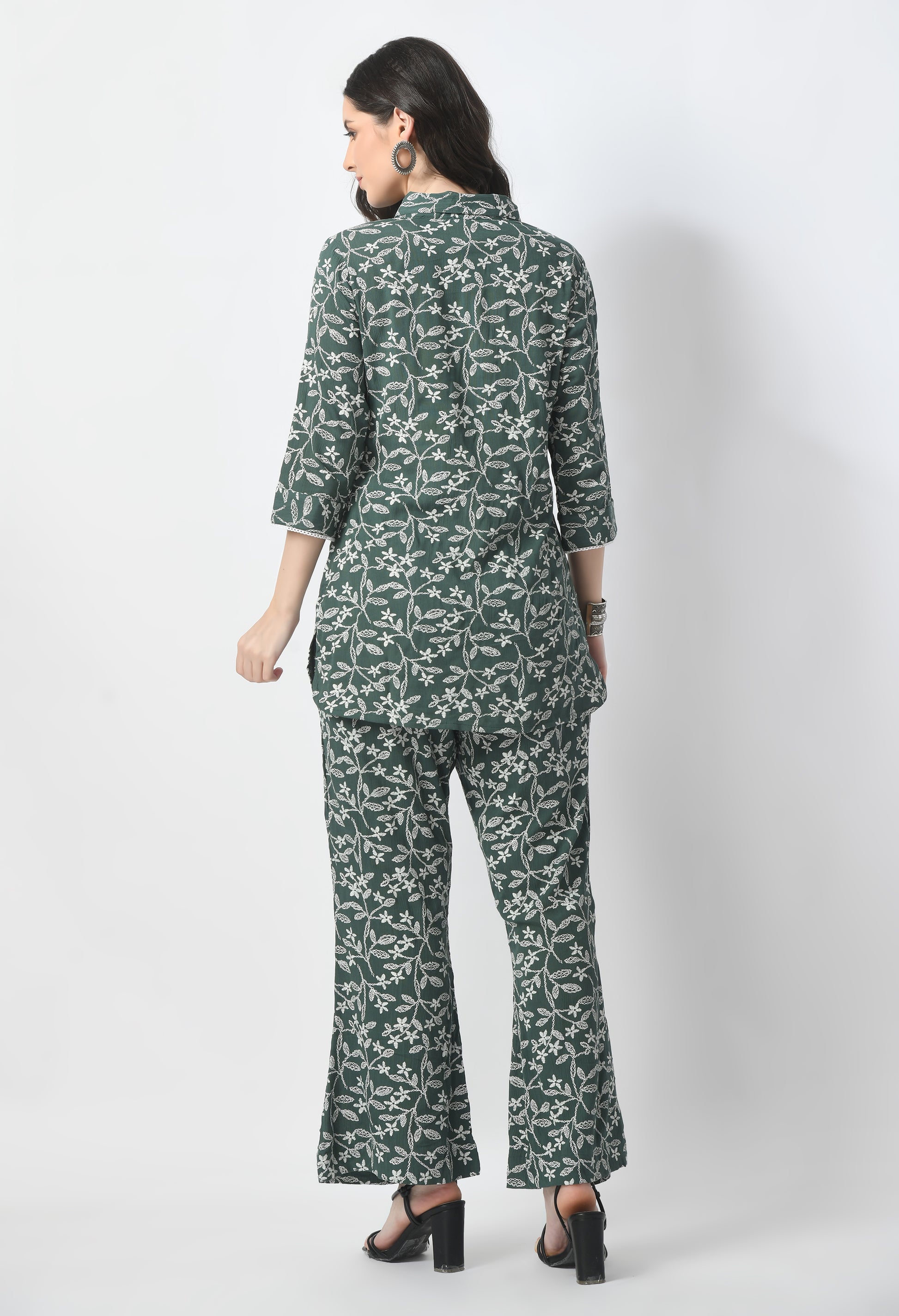 "Rayon Crape Co-Ord Set with a matching printed top and high-waisted trousers. The top has a relaxed fit and flutter sleeves, while the trousers have a wide-leg style. Made from lightweight and breathable fabric."