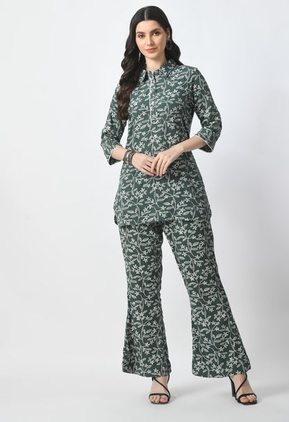 "Rayon Crape Co-Ord Set with a matching printed top and high-waisted trousers. The top has a relaxed fit and flutter sleeves, while the trousers have a wide-leg style. Made from lightweight and breathable fabric."