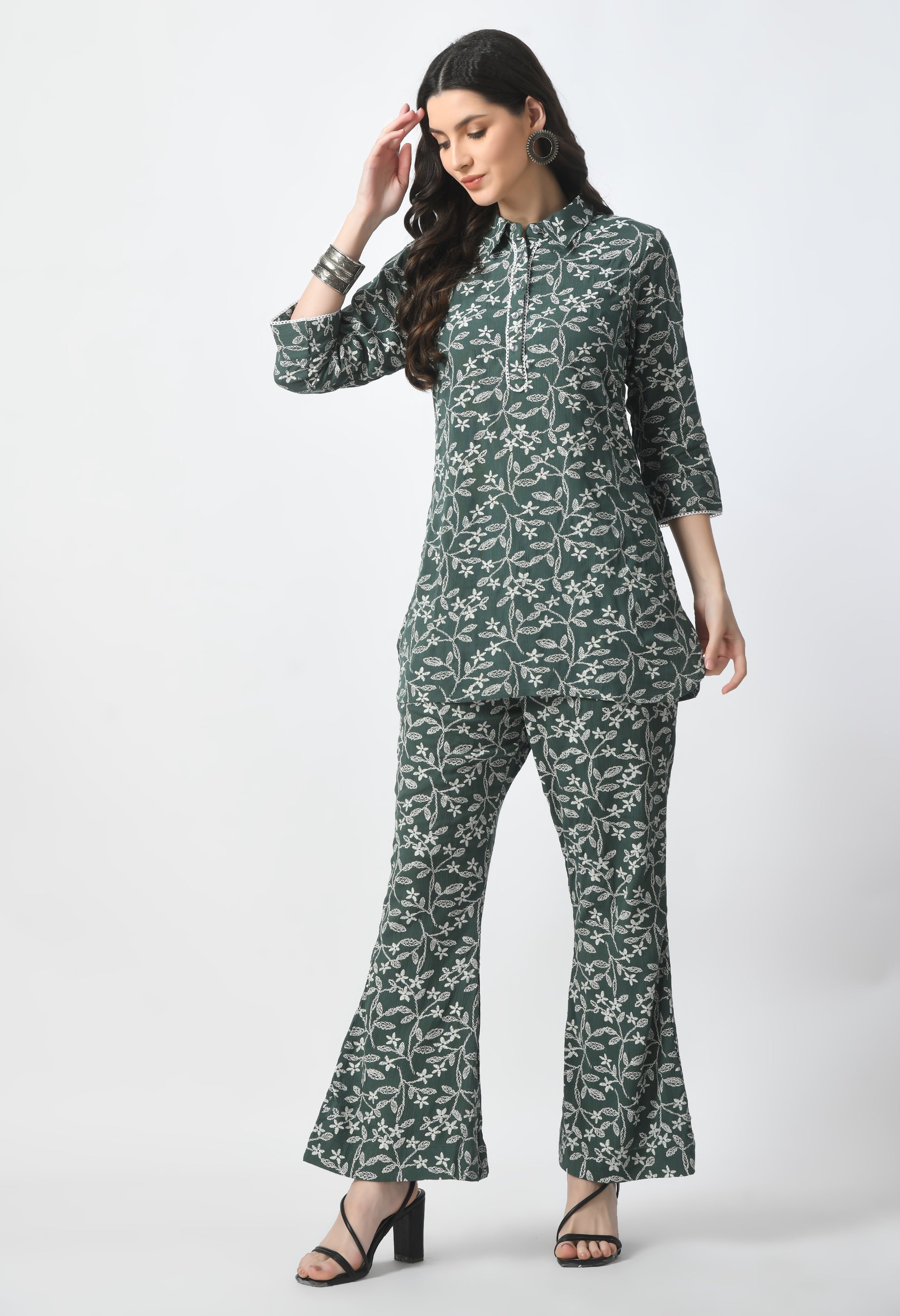 "Rayon Crape Co-Ord Set with a matching printed top and high-waisted trousers. The top has a relaxed fit and flutter sleeves, while the trousers have a wide-leg style. Made from lightweight and breathable fabric."