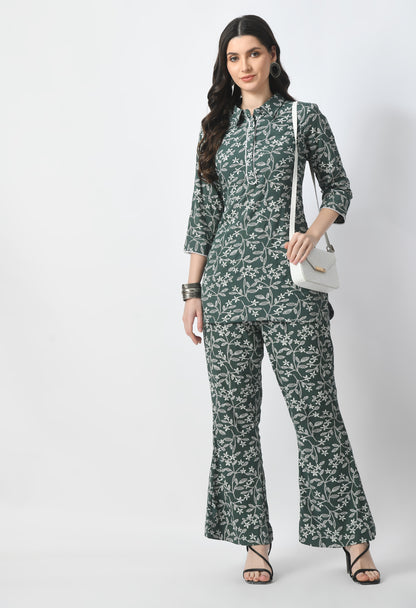 "Rayon Crape Co-Ord Set with a matching printed top and high-waisted trousers. The top has a relaxed fit and flutter sleeves, while the trousers have a wide-leg style. Made from lightweight and breathable fabric."