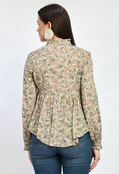 “Modal loose fit top with ruffles and a vibrant print. The soft, luxurious modal fabric offers a relaxed, comfortable fit, while the playful ruffles and stylish print add a touch of effortless elegance.”