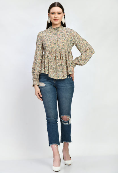 “Modal loose fit top with ruffles and a vibrant print. The soft, luxurious modal fabric offers a relaxed, comfortable fit, while the playful ruffles and stylish print add a touch of effortless elegance.”