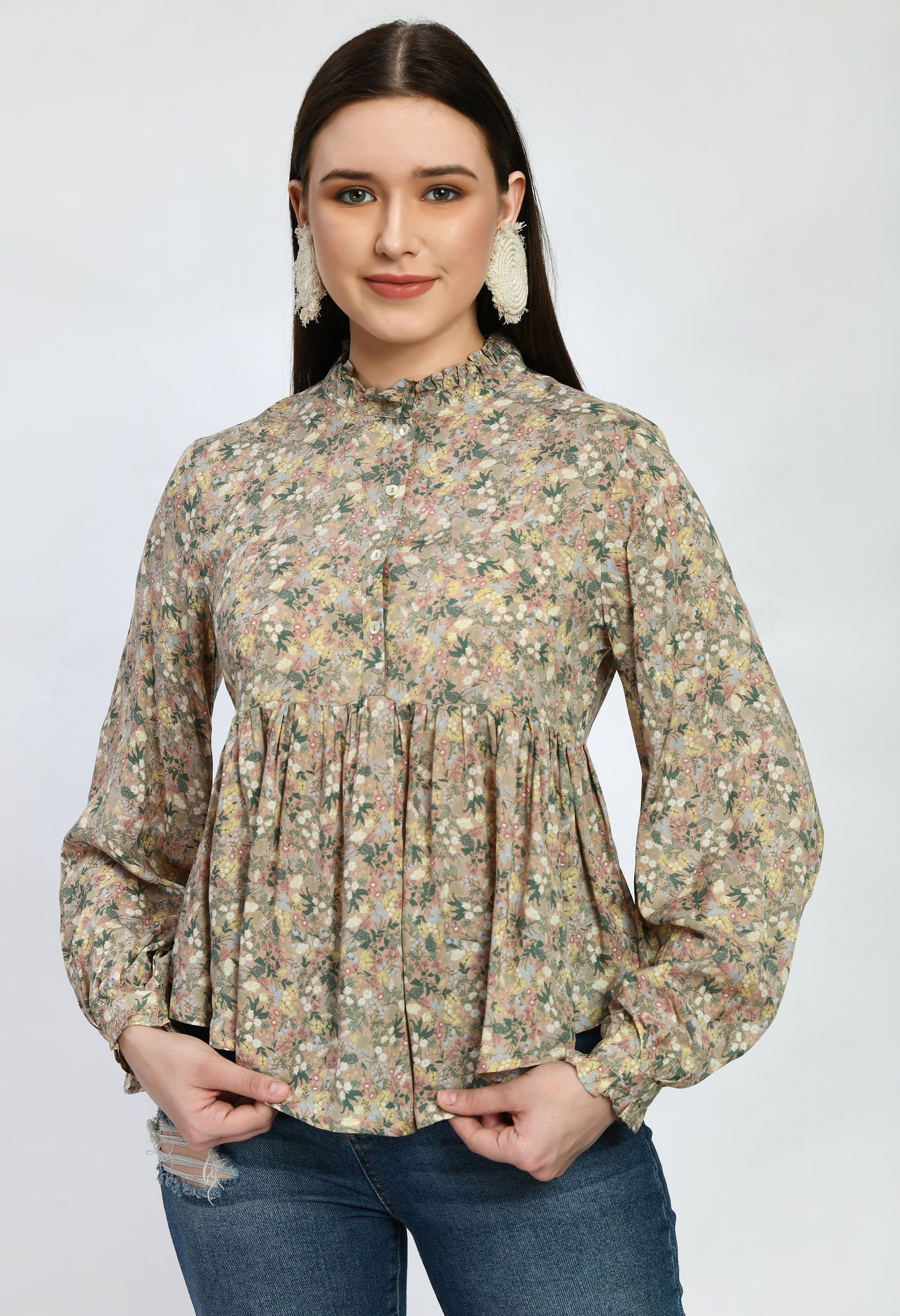 “Modal loose fit top with ruffles and a vibrant print. The soft, luxurious modal fabric offers a relaxed, comfortable fit, while the playful ruffles and stylish print add a touch of effortless elegance.”