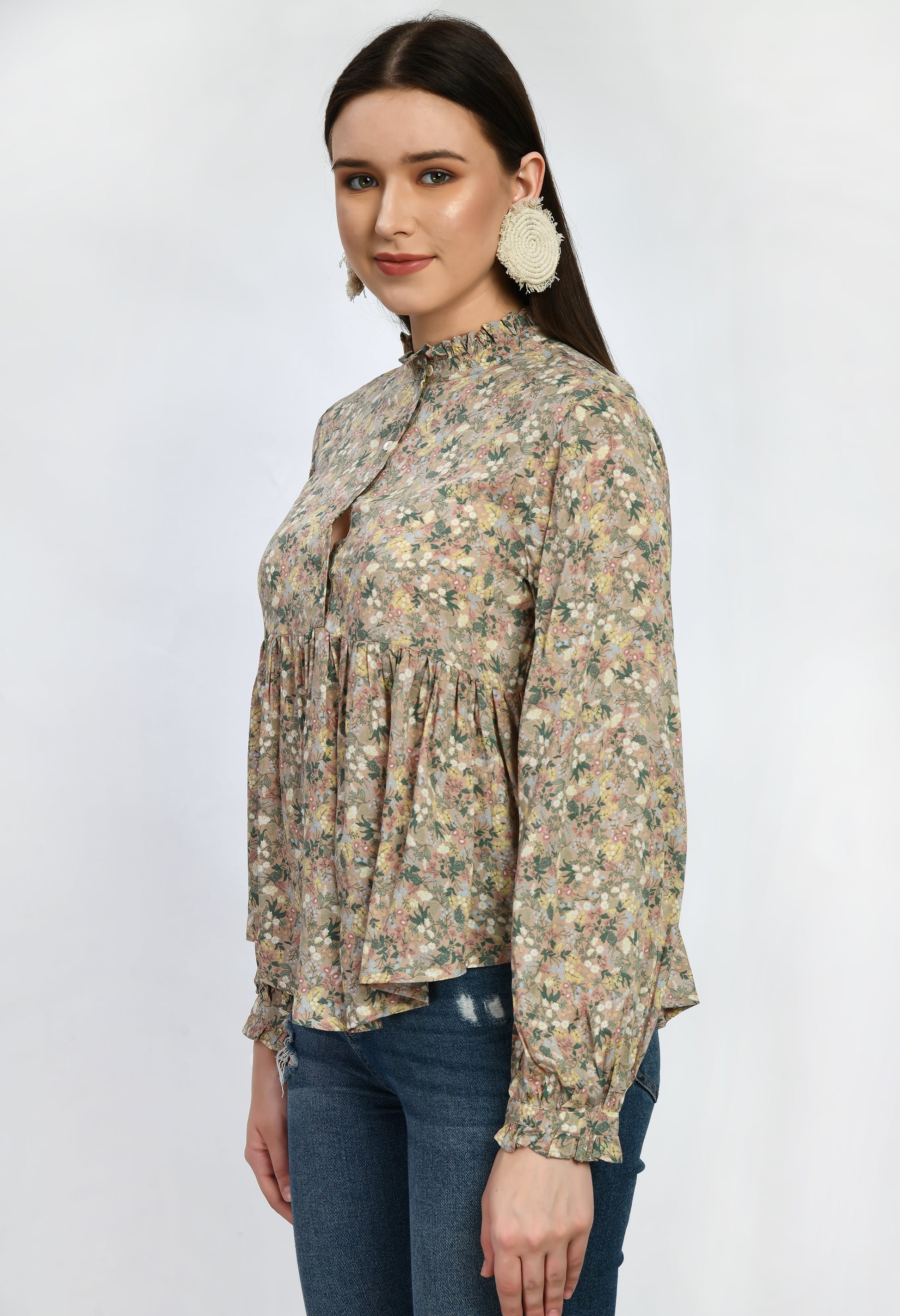 “Modal loose fit top with ruffles and a vibrant print. The soft, luxurious modal fabric offers a relaxed, comfortable fit, while the playful ruffles and stylish print add a touch of effortless elegance.”