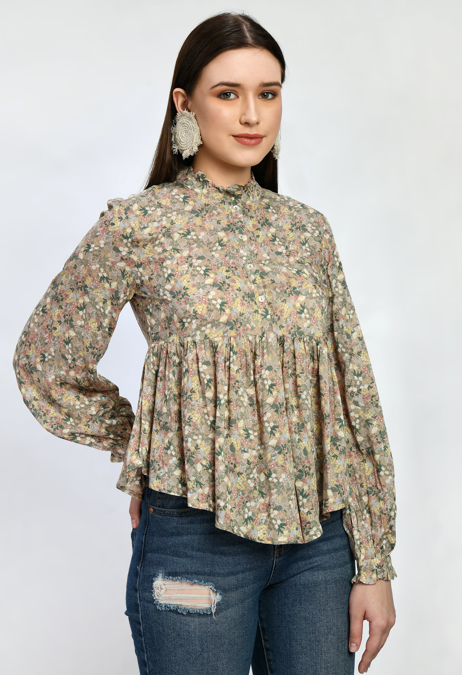 “Modal loose fit top with ruffles and a vibrant print. The soft, luxurious modal fabric offers a relaxed, comfortable fit, while the playful ruffles and stylish print add a touch of effortless elegance.”