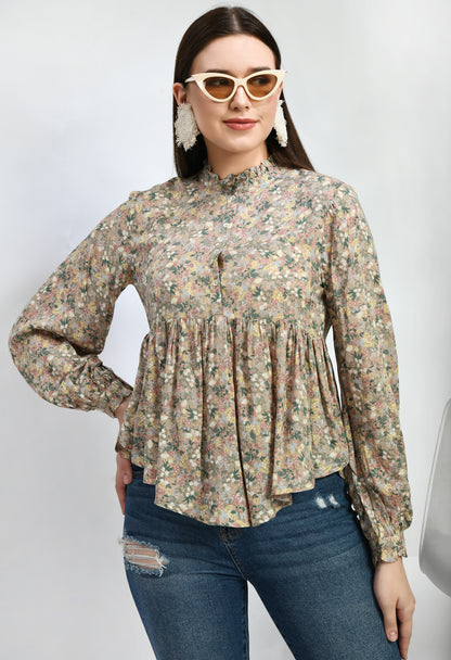 “Modal loose fit top with ruffles and a vibrant print. The soft, luxurious modal fabric offers a relaxed, comfortable fit, while the playful ruffles and stylish print add a touch of effortless elegance.”