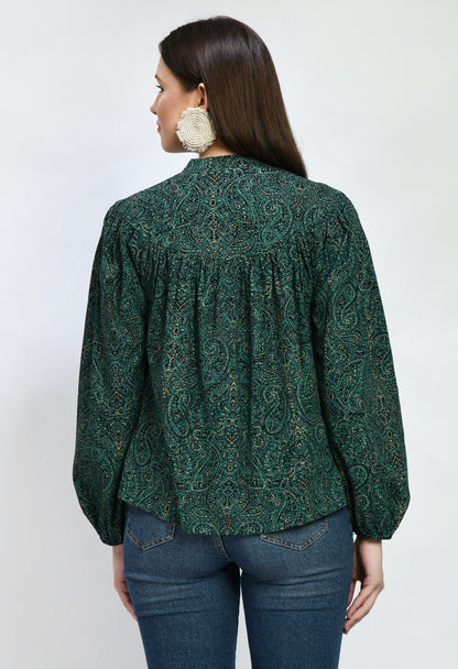 "A loose-fitting green rayon top with an airy, carefree style. With its soft, breathable fabric, it provides comfort and style for semi-formal and casual occasions alike.