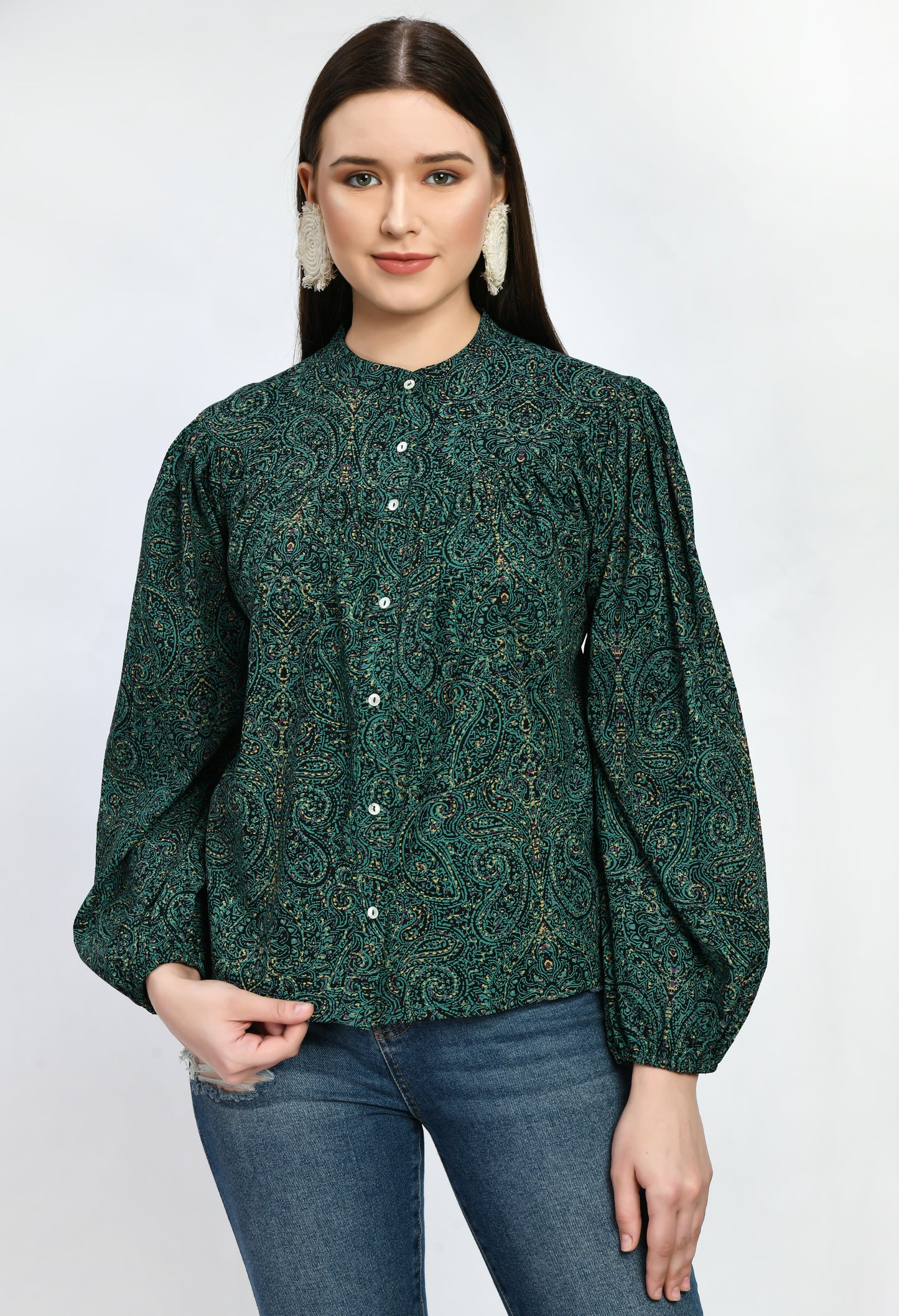 "A loose-fitting green rayon top with an airy, carefree style. With its soft, breathable fabric, it provides comfort and style for semi-formal and casual occasions alike.