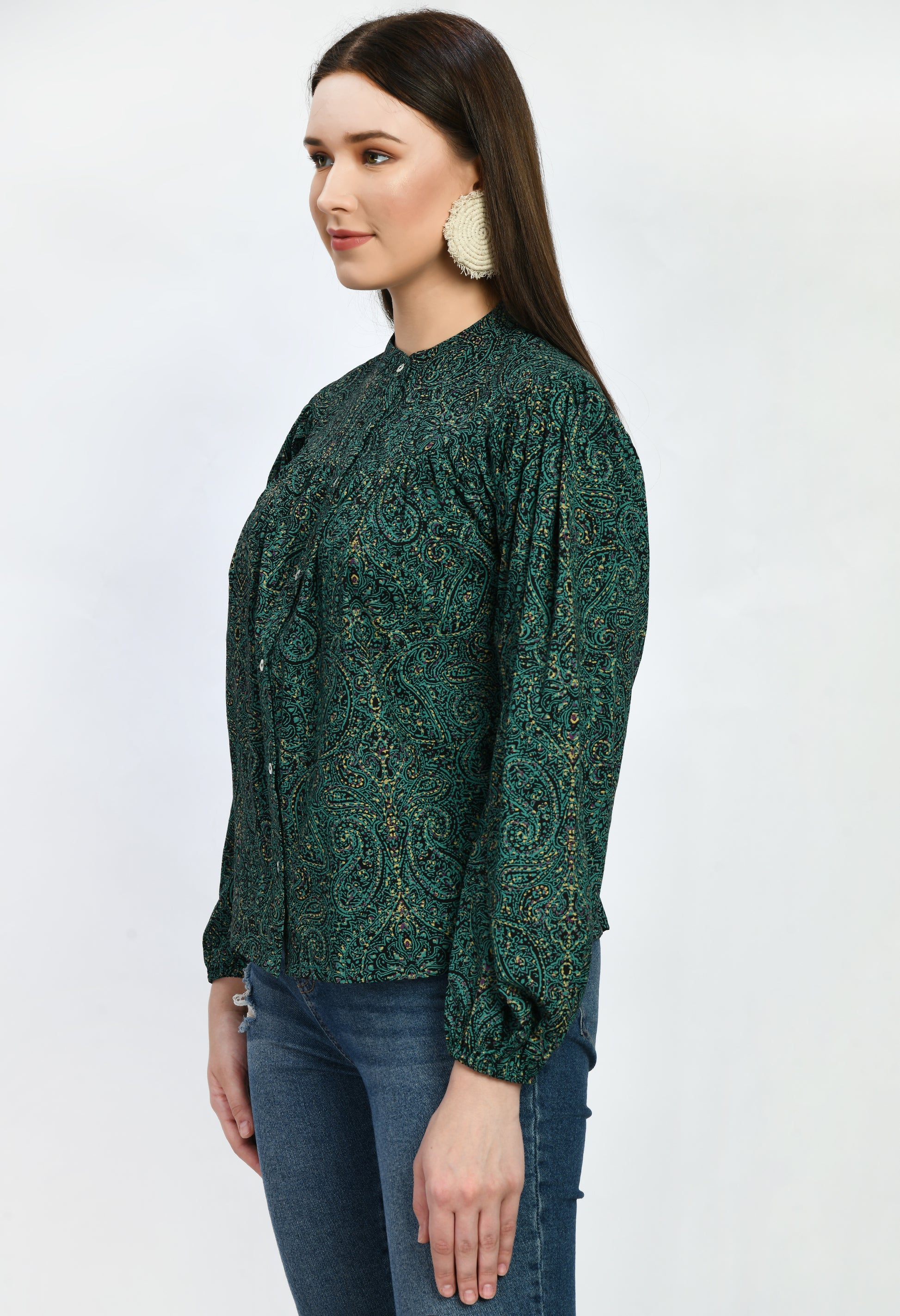 "A loose-fitting green rayon top with an airy, carefree style. With its soft, breathable fabric, it provides comfort and style for semi-formal and casual occasions alike.