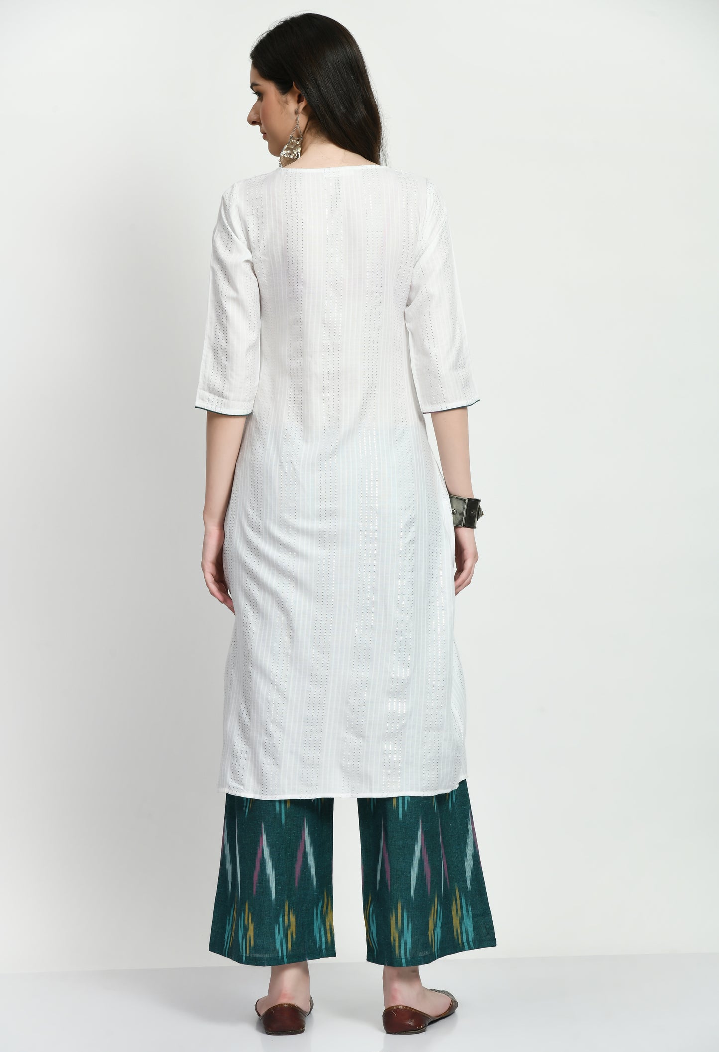 An exquisite Anarkali Kurta set with a flowing, finely designed Kurta, Ikkat-patterned pants, and a gorgeously embroidered dupatta. Perfect for celebrations and unique gatherings, this ensemble blends classic elegance with contemporary refinement.