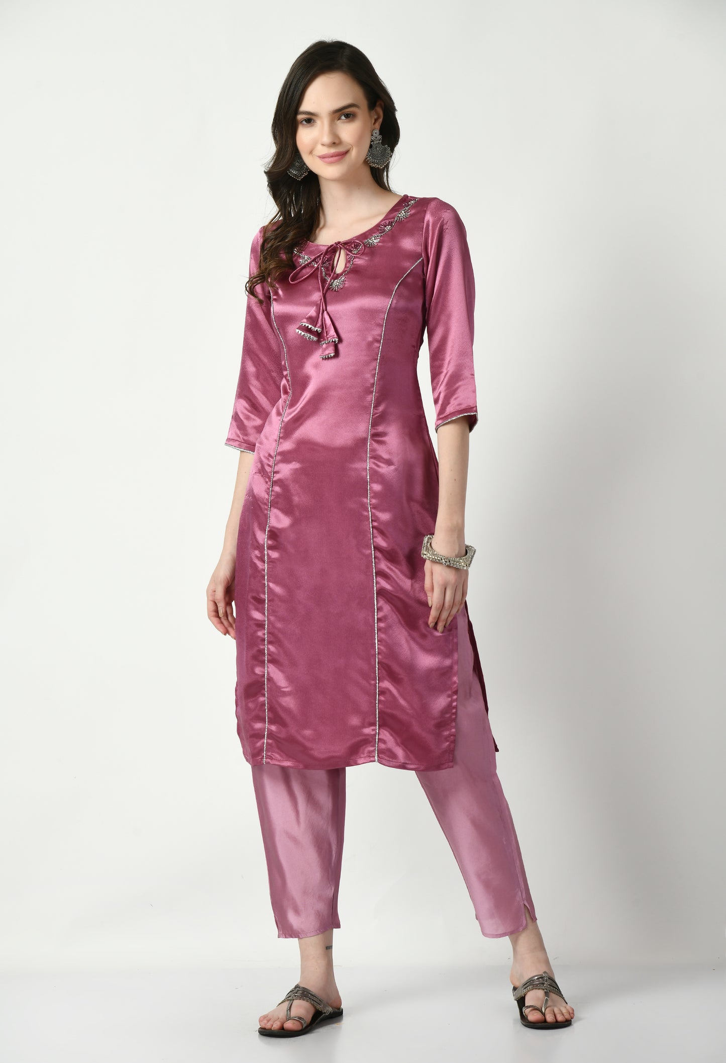 "Purple polyester kurta set featuring a vibrant purple kurta with matching pants and a coordinating dupatta. The lightweight fabric ensures comfort and elegance, perfect for festive events or casual gatherings."