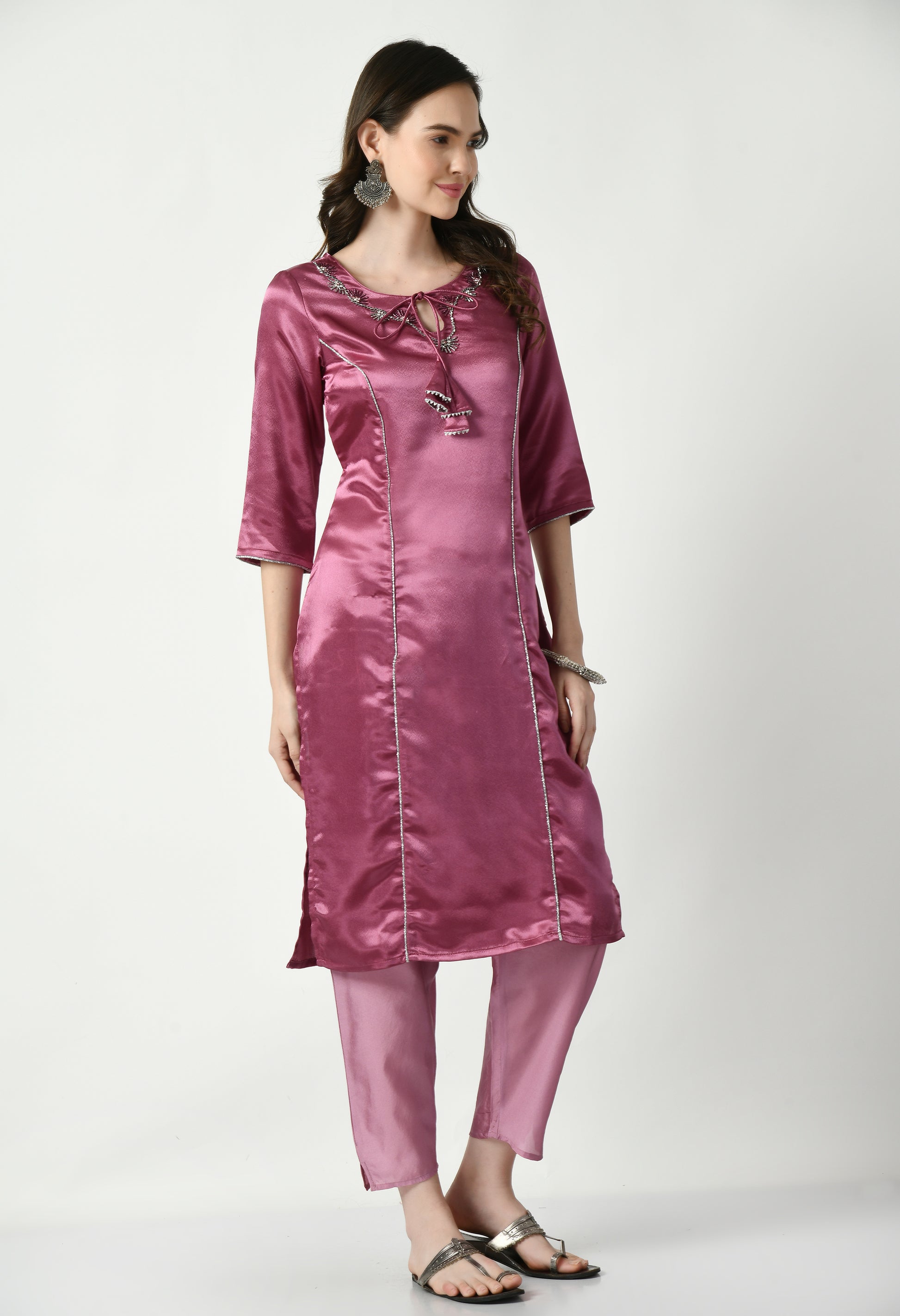 "Purple polyester kurta set featuring a vibrant purple kurta with matching pants and a coordinating dupatta. The lightweight fabric ensures comfort and elegance, perfect for festive events or casual gatherings."