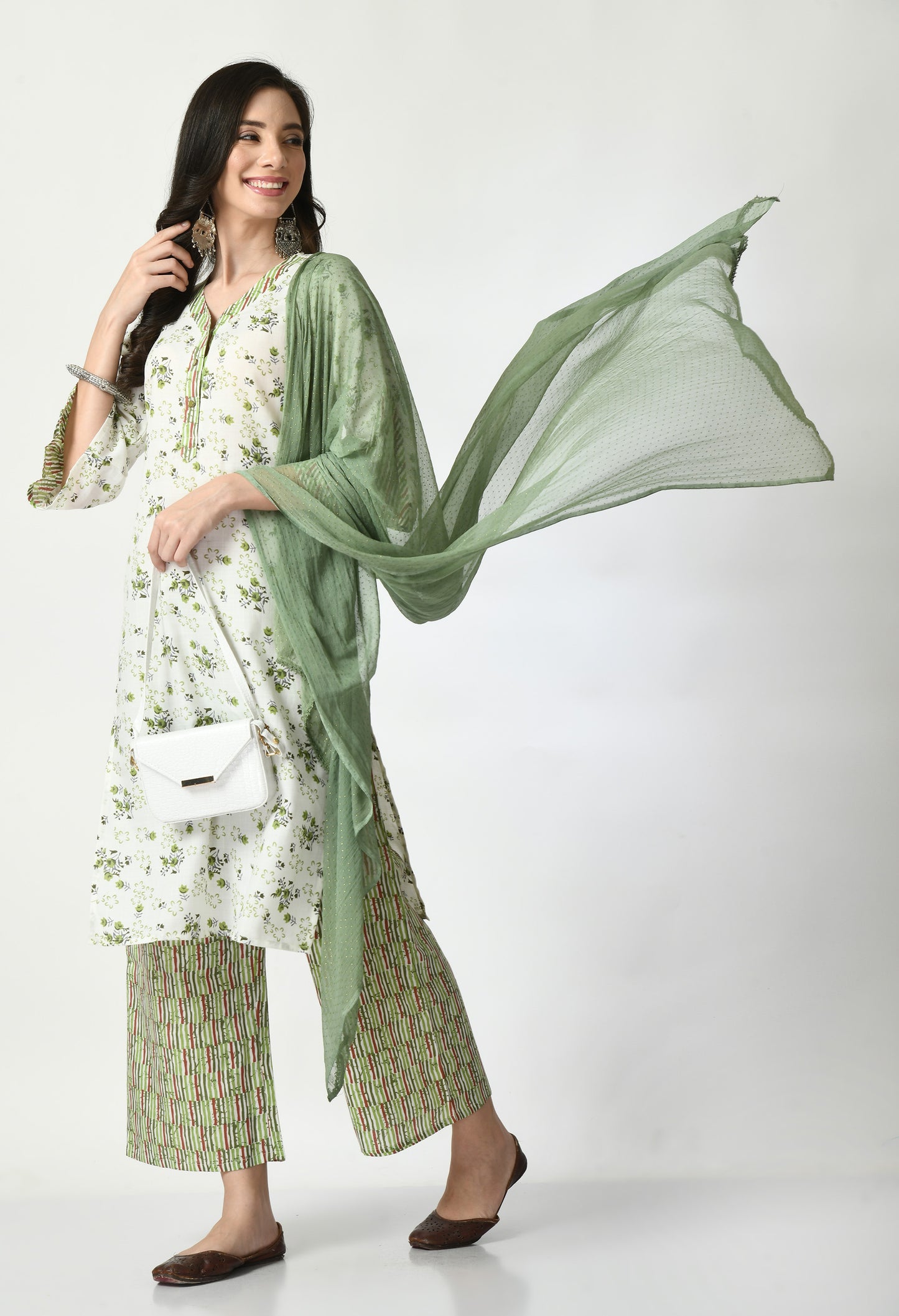 "Elegant women's ethnic ensemble featuring a printed kurta, palazzo pants, and a matching dupatta. The set showcases intricate patterns and a stylish design, ideal for festive or casual occasions."