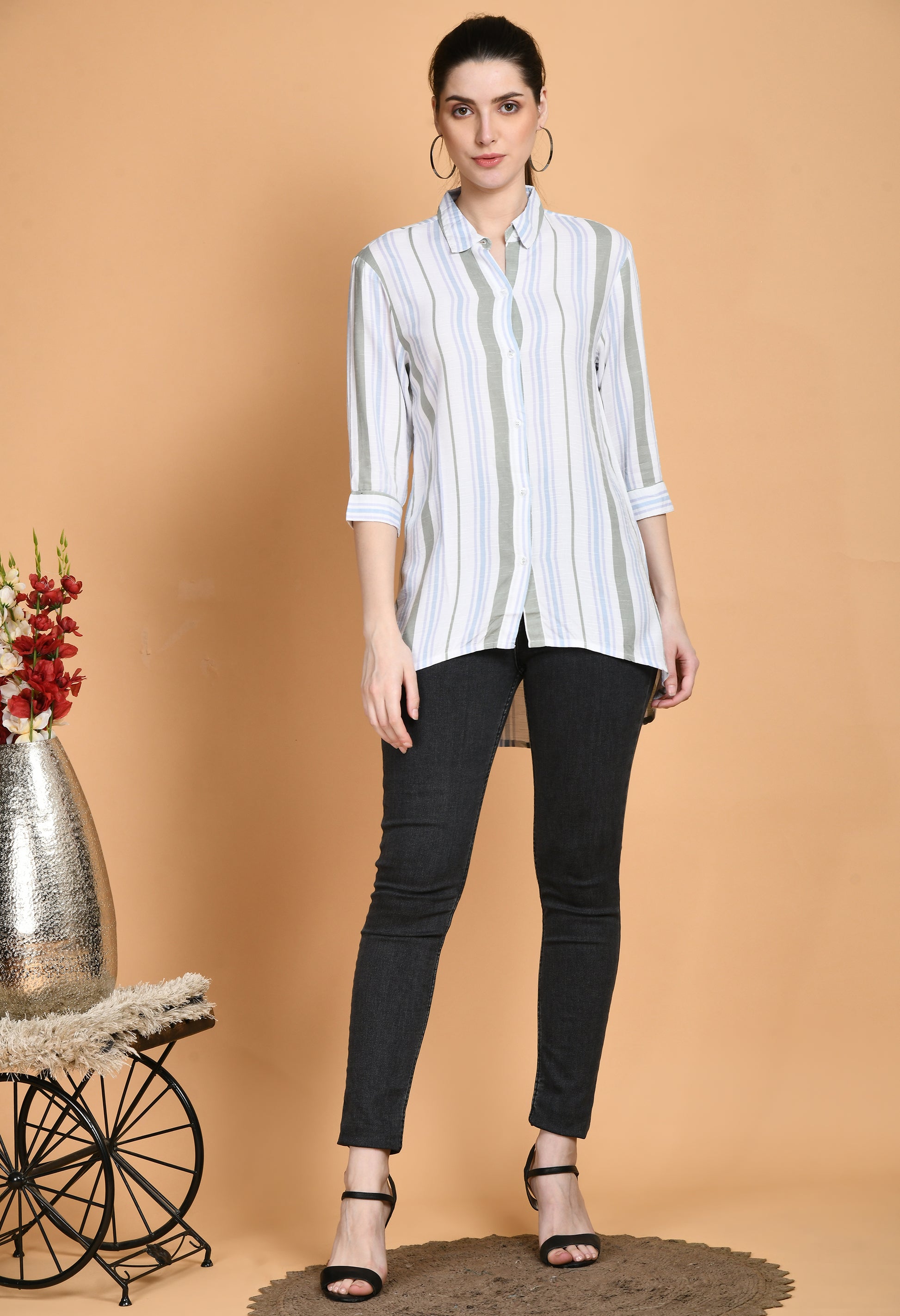 The Rayon White Stripes Shirt has a classic tailored style with vertical white stripes. The shirt has a traditional collar, long sleeves with buttoned cuffs, and a button-down front. Because of the softness and breathability of the rayon fabric, it combines comfort and style."