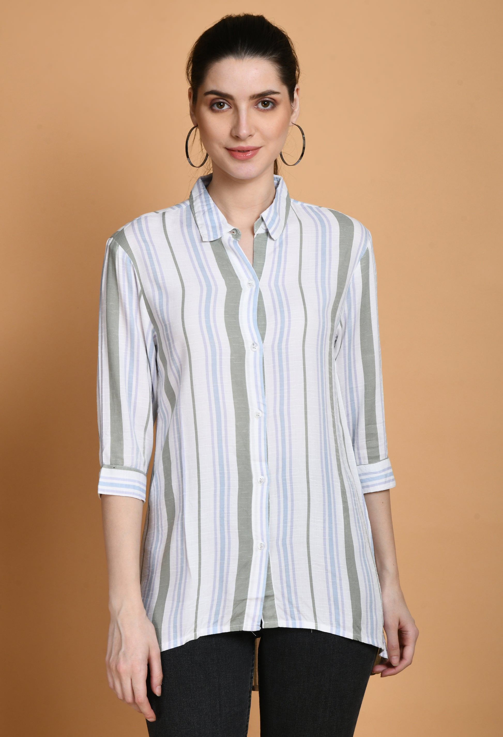 The Rayon White Stripes Shirt has a classic tailored style with vertical white stripes. The shirt has a traditional collar, long sleeves with buttoned cuffs, and a button-down front. Because of the softness and breathability of the rayon fabric, it combines comfort and style."