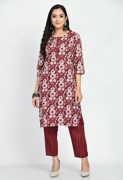 “Maroon cotton printed kurta with matching pants. The kurta features intricate prints and a rich maroon color, paired with coordinating pants, combining elegance with comfort for a versatile look suitable for casual and semi-formal occasions.”