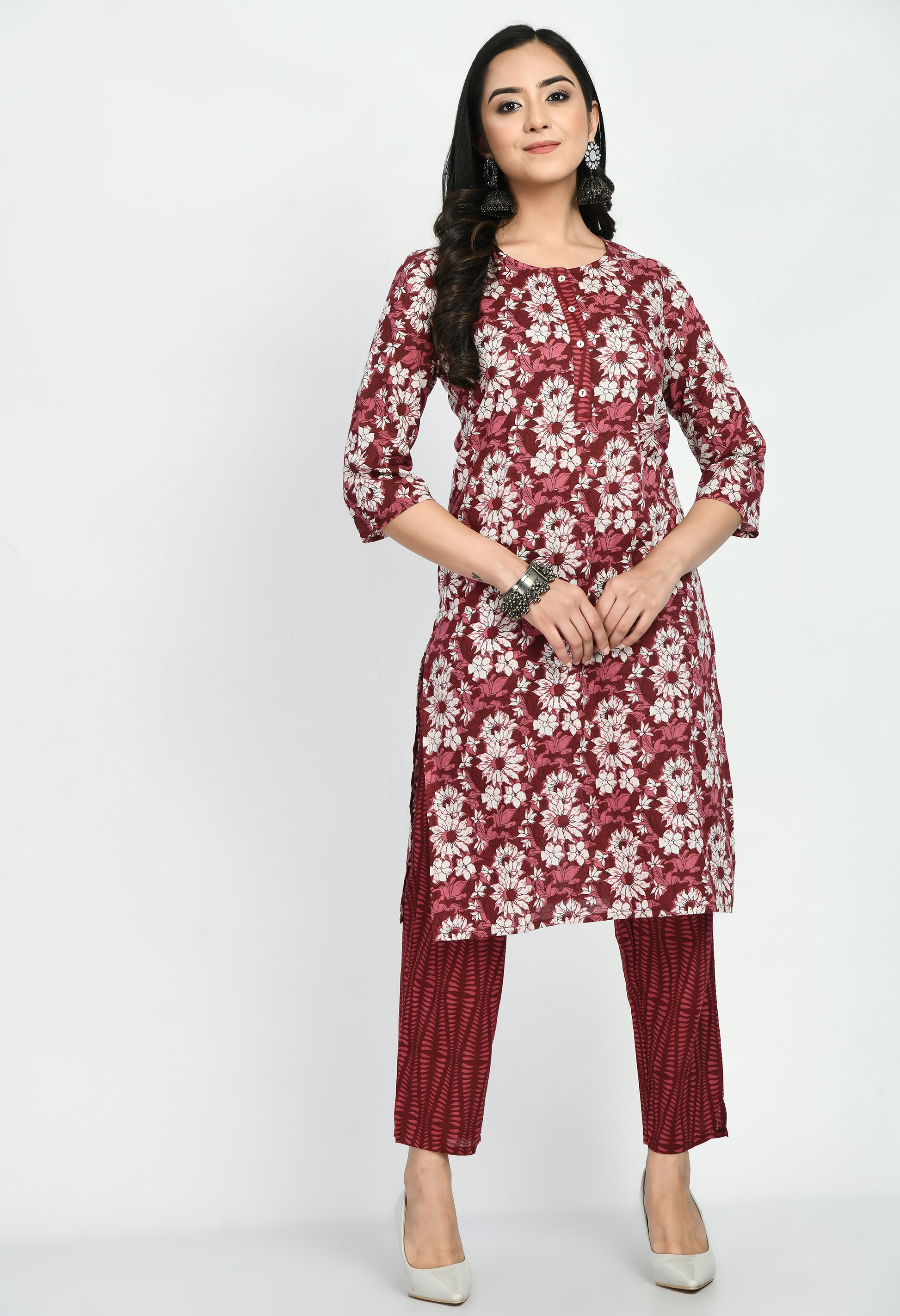 “Maroon cotton printed kurta with matching pants. The kurta features intricate prints and a rich maroon color, paired with coordinating pants, combining elegance with comfort for a versatile look suitable for casual and semi-formal occasions.”