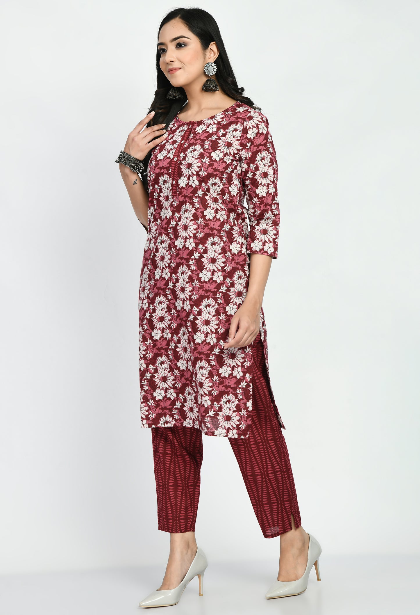 “Maroon cotton printed kurta with matching pants. The kurta features intricate prints and a rich maroon color, paired with coordinating pants, combining elegance with comfort for a versatile look suitable for casual and semi-formal occasions.”