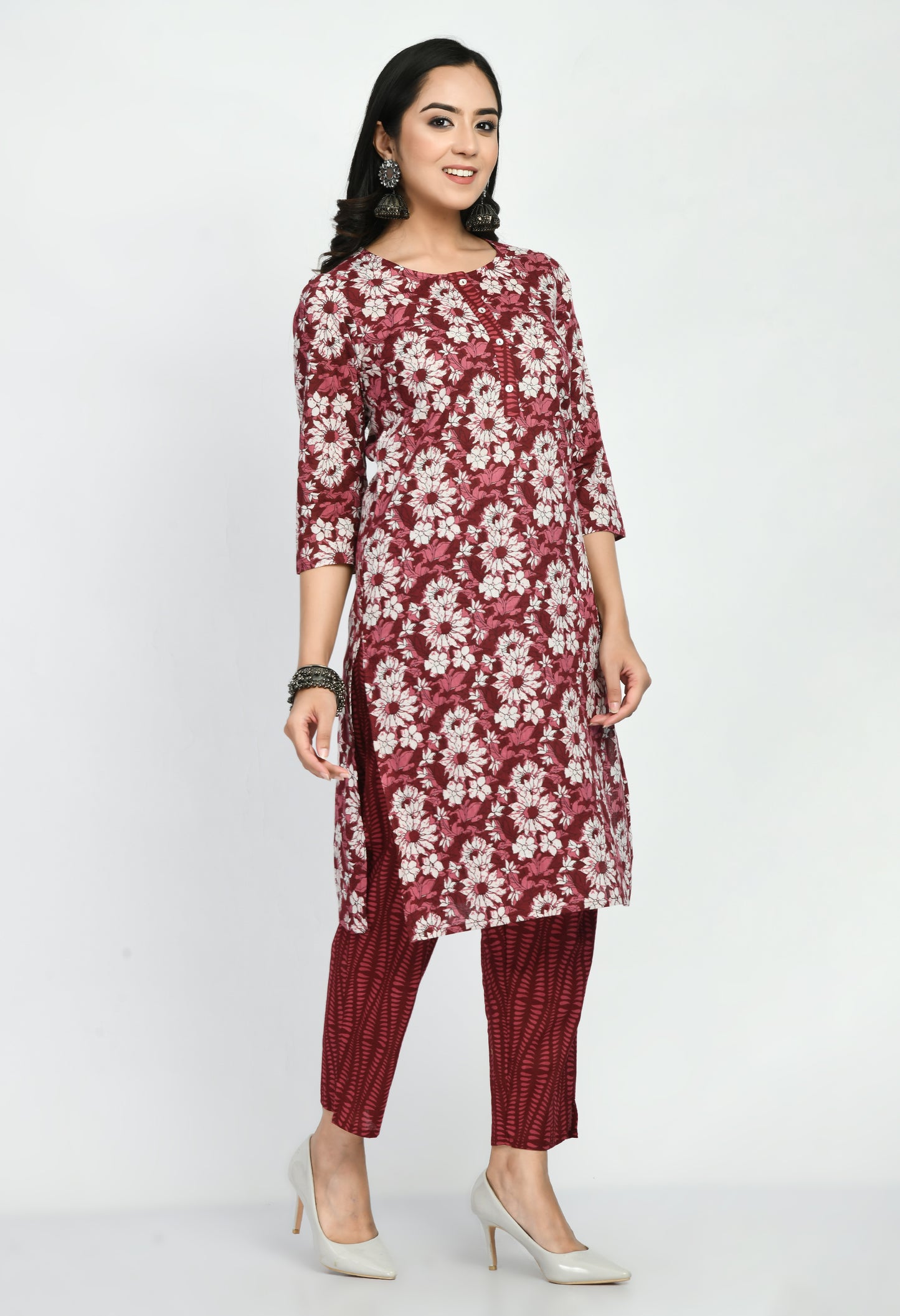 “Maroon cotton printed kurta with matching pants. The kurta features intricate prints and a rich maroon color, paired with coordinating pants, combining elegance with comfort for a versatile look suitable for casual and semi-formal occasions.”