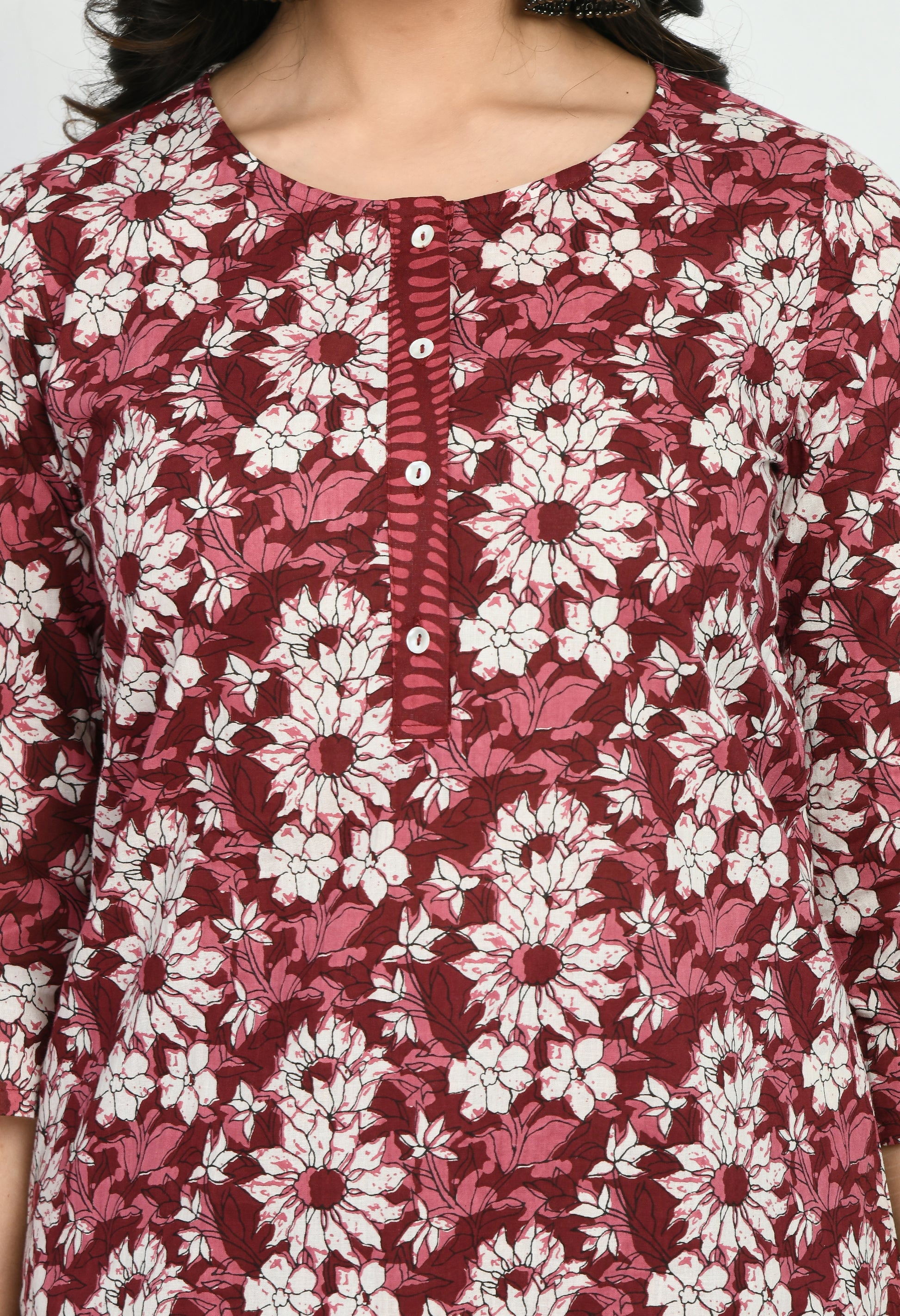 “Maroon cotton printed kurta with matching pants. The kurta features intricate prints and a rich maroon color, paired with coordinating pants, combining elegance with comfort for a versatile look suitable for casual and semi-formal occasions.”