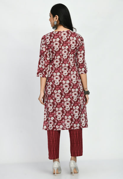 “Maroon cotton printed kurta with matching pants. The kurta features intricate prints and a rich maroon color, paired with coordinating pants, combining elegance with comfort for a versatile look suitable for casual and semi-formal occasions.”